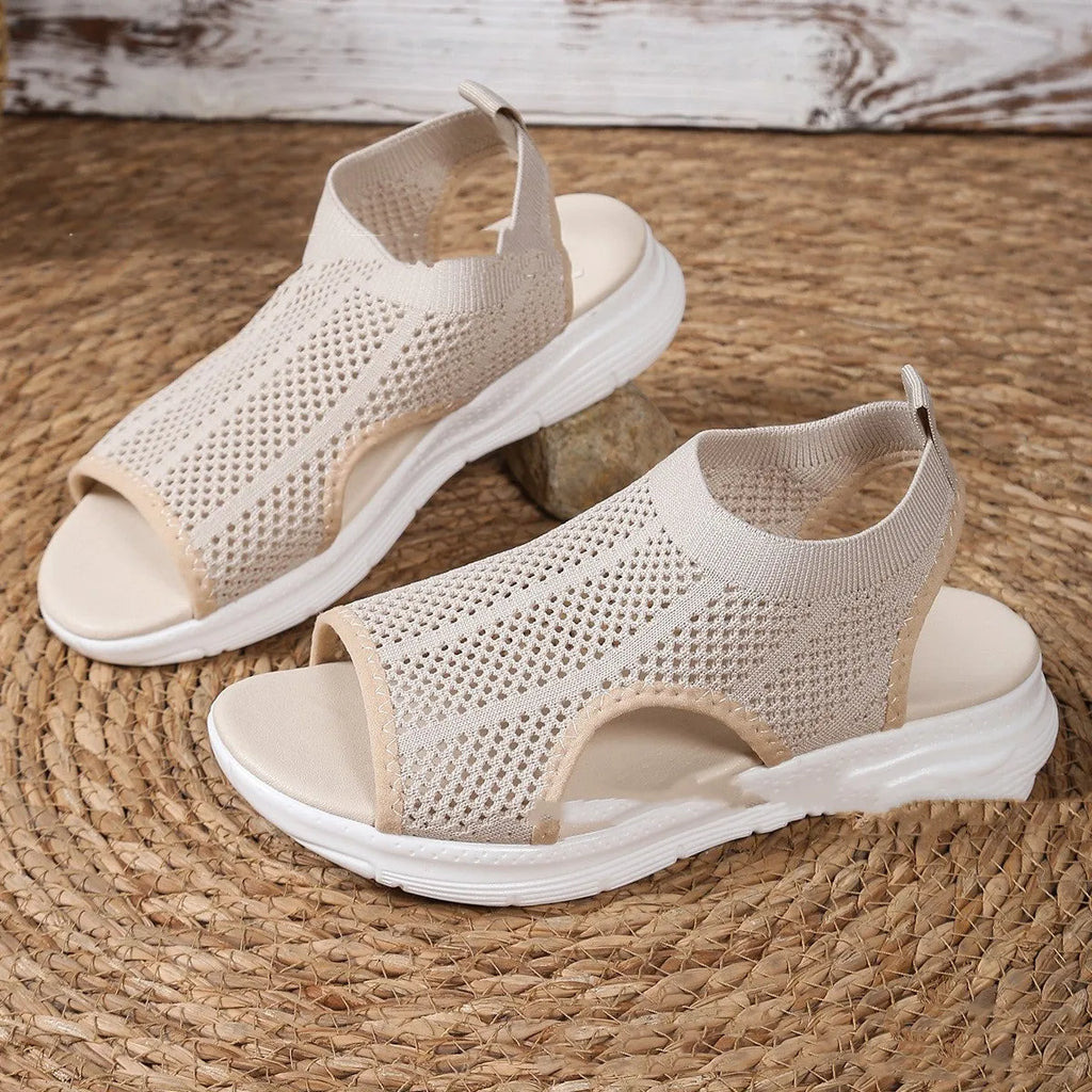 Women's black platform sports sandals with a flat toe and mesh lining on a rubber sole.