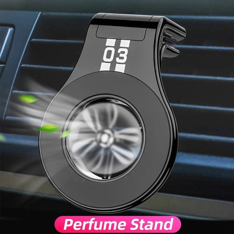 Black universal magnetic car phone holder clipped to a car air vent, holding a smartphone.