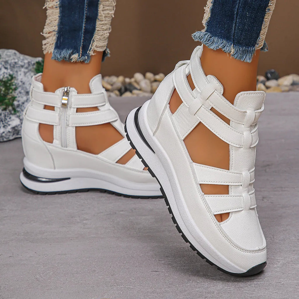Women's black close-toed hollow-out platform sandals with Velcro strap on a white background