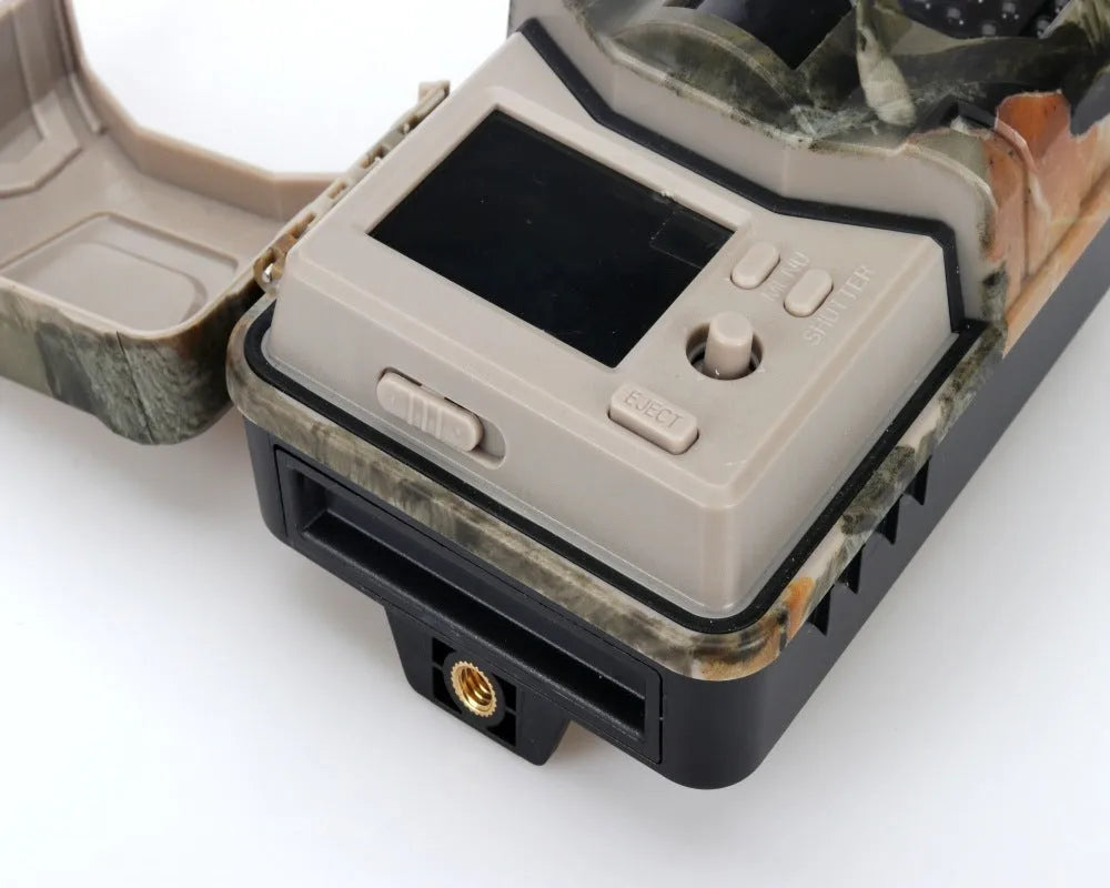 Camouflaged outdoor Bluetooth hunting camera with infrared LEDs for night vision.