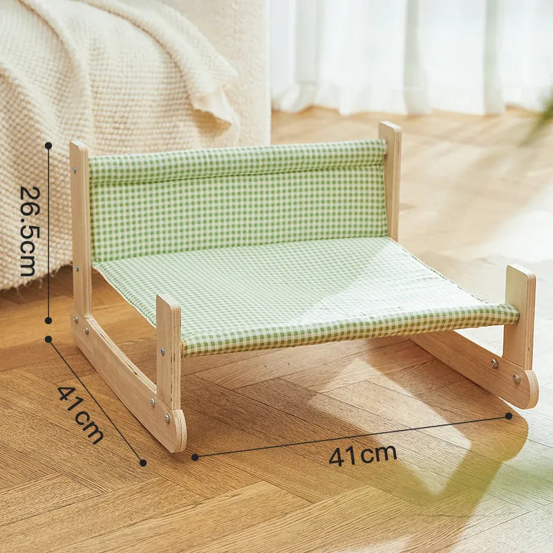 Blue wooden elevated cat bed with fabric hammock for indoor feline lounging