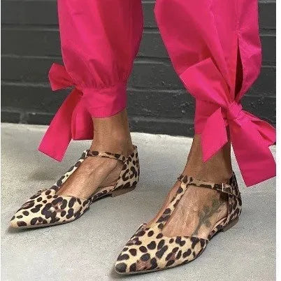 Leopard print women's pumps with pointed toe and low chunky heel on rubber sole