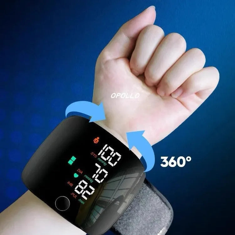 Black wrist blood pressure monitor with digital LCD screen and USB charging port