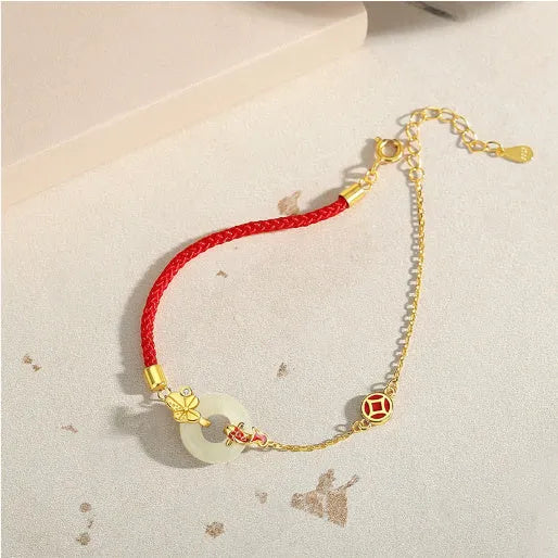 Women's koi peace buckle bracelet in 925 silver with electroplated gold finish on red rope