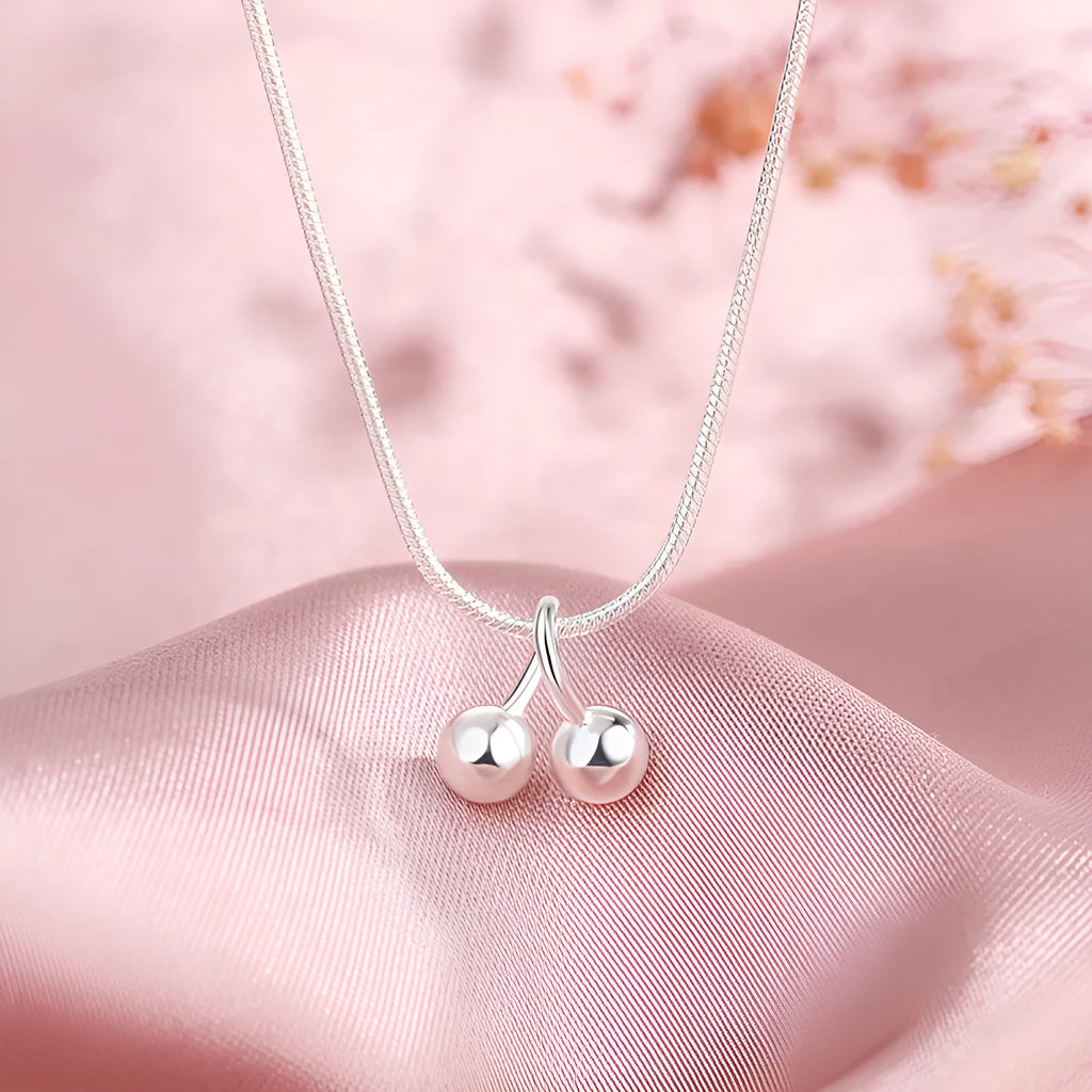 Silver cherry necklace for women with adjustable snake bone chain and Korean-style fruit pendant.