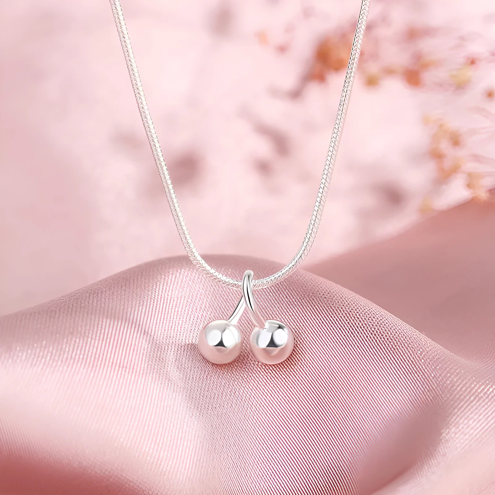 Silver cherry necklace for women with adjustable snake bone chain and Korean-style fruit pendant.