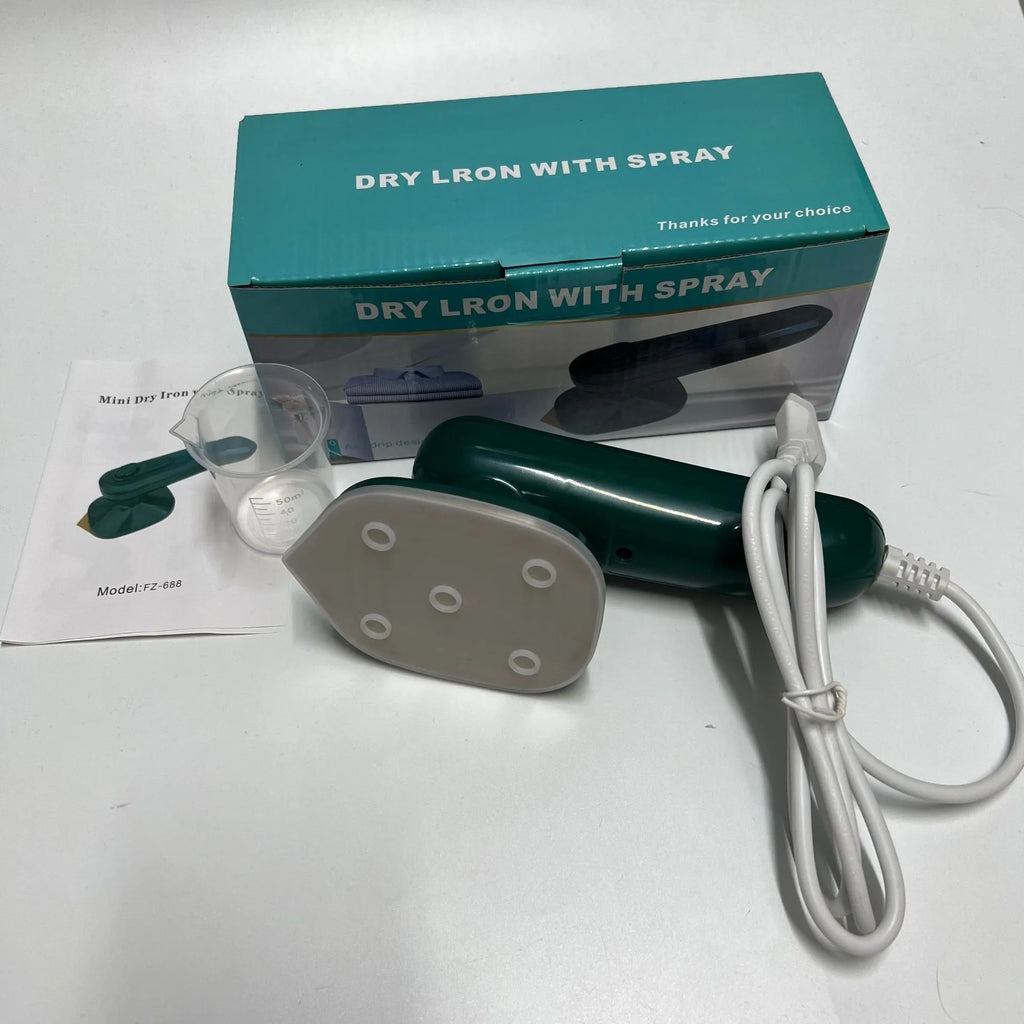 Handheld portable garment steamer in dark green with large titanium soleplate