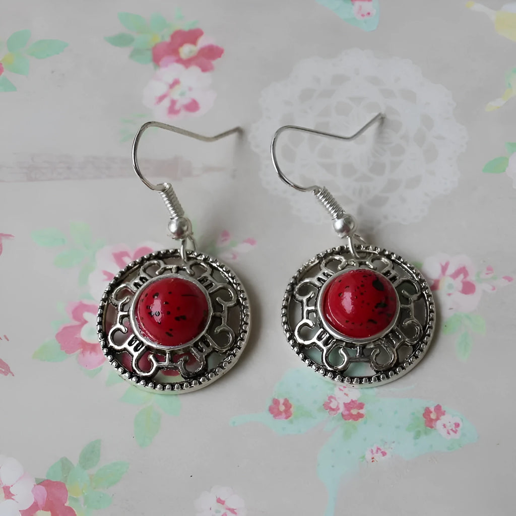 Handmade geometric flower disk earrings in Tibetan silver and turquoise with auspicious cloud patterns.