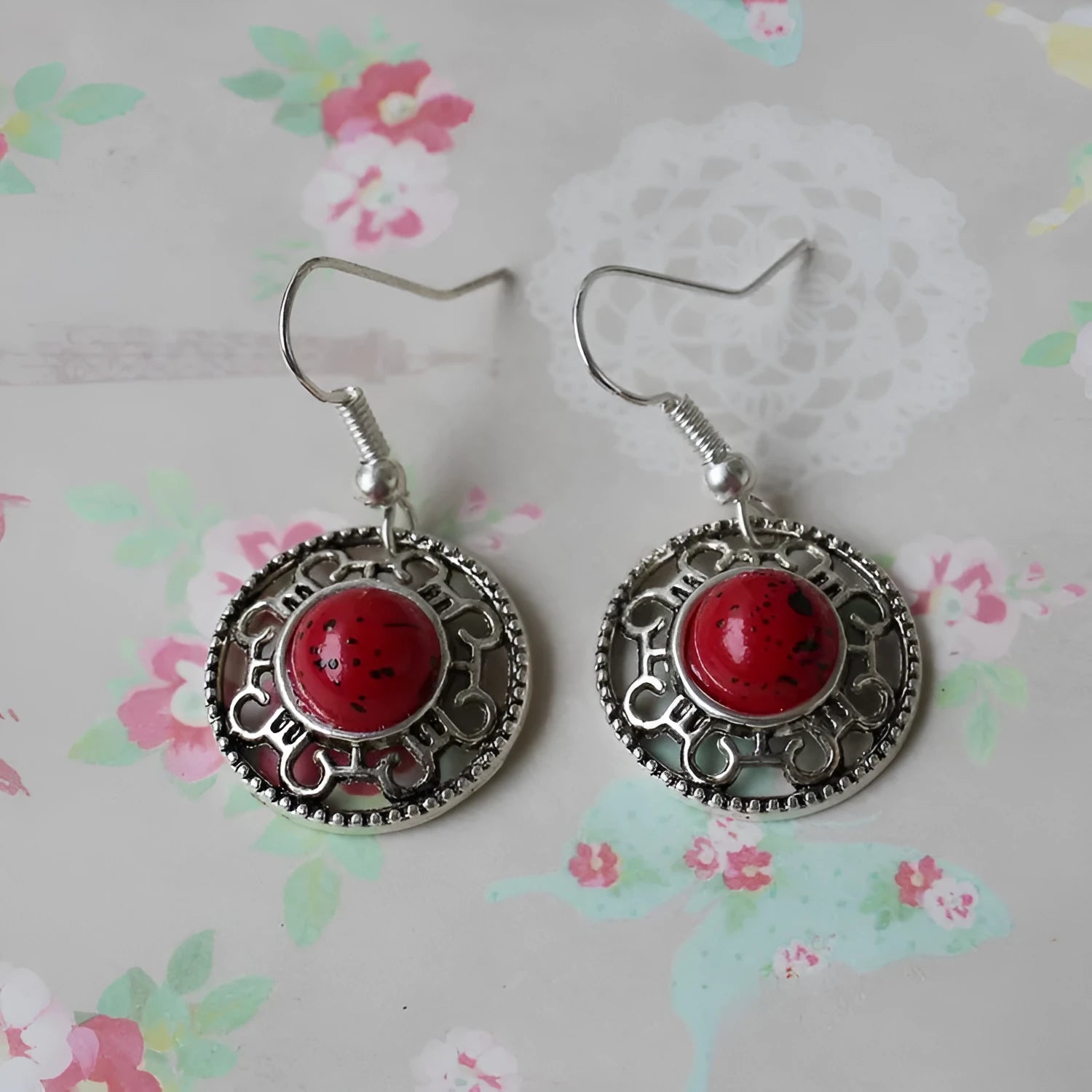 Handmade geometric flower disk earrings in Tibetan silver and turquoise with auspicious cloud patterns.