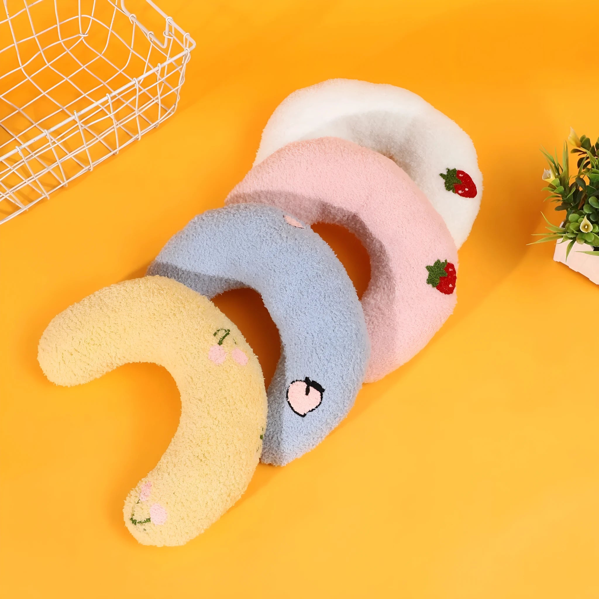 Cartoon half moon shaped U-shaped fabric pillow for cats in blue, pink, white, and yellow colour options