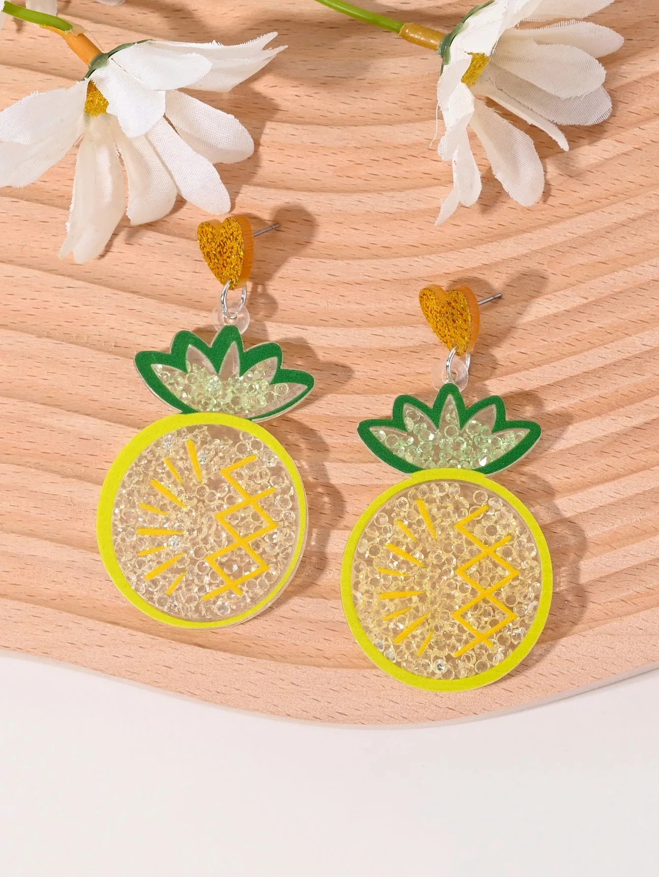 Colourful acrylic fruit and ice cream dangle earrings for women on a white background.