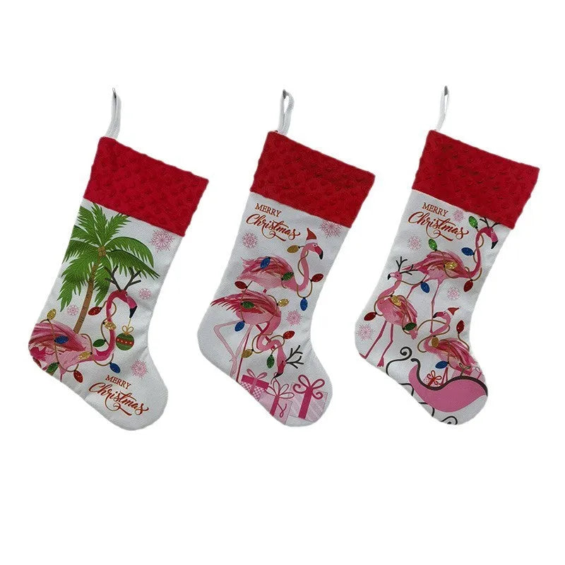 Red cloth Christmas stocking with flamingo design, 46cm long, hanging on fireplace.