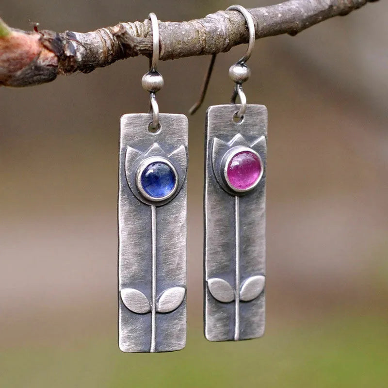 Geometric red sapphire earrings for women with an antique finish and ellipse details.
