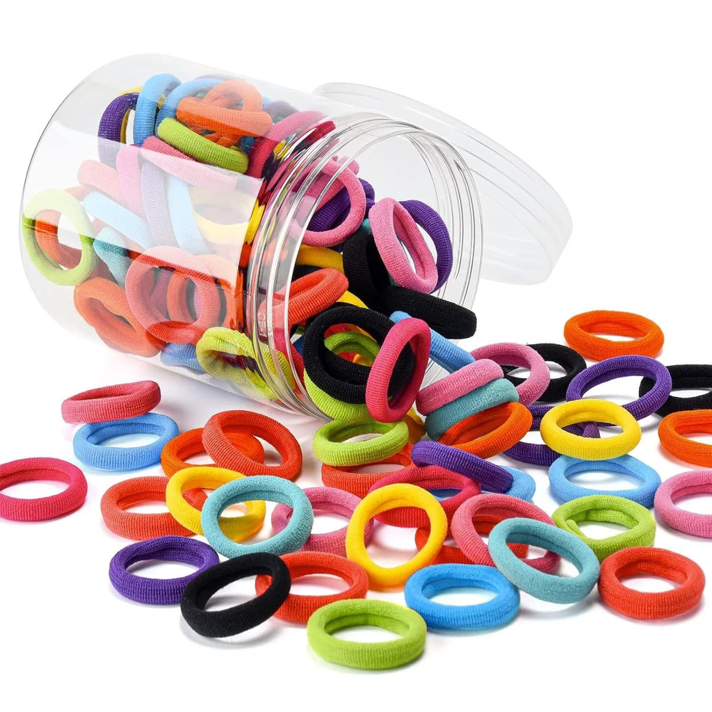100 baby hair ties in mixed colours showing seamless cotton construction and small 0.85-inch sizing