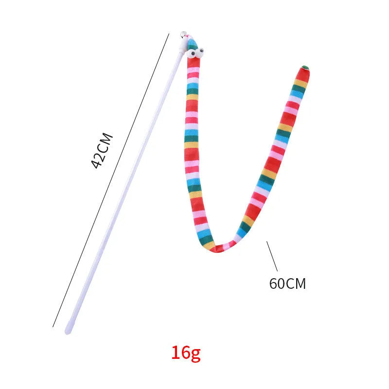 Colourful cat teaser wand with a long plush strip and a bell, held by a person.