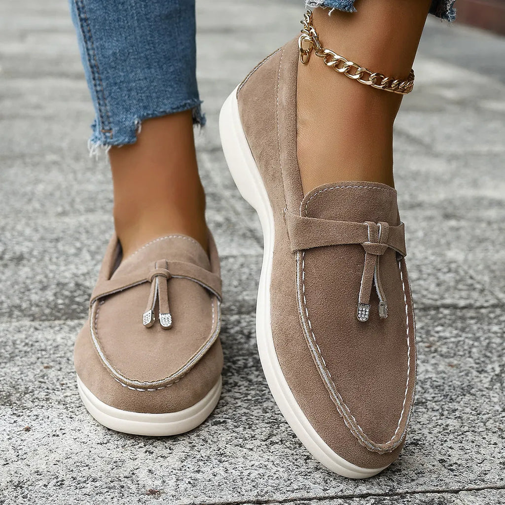 Casual slip-on loafers with canvas upper, platform rubber sole, and round toe in black colour