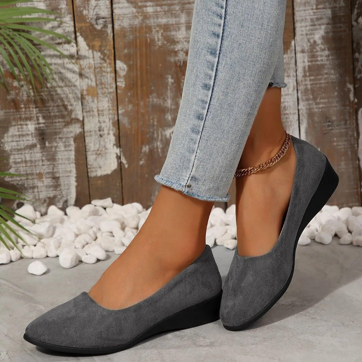 Women's plus size low wedge pumps in Gommino style with pointed toe and suede upper.