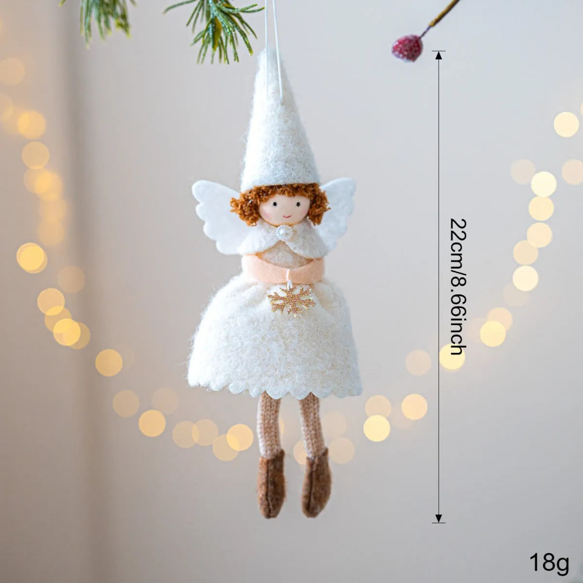 White cloth angel skirt Christmas pendant with plush texture on green tree branch