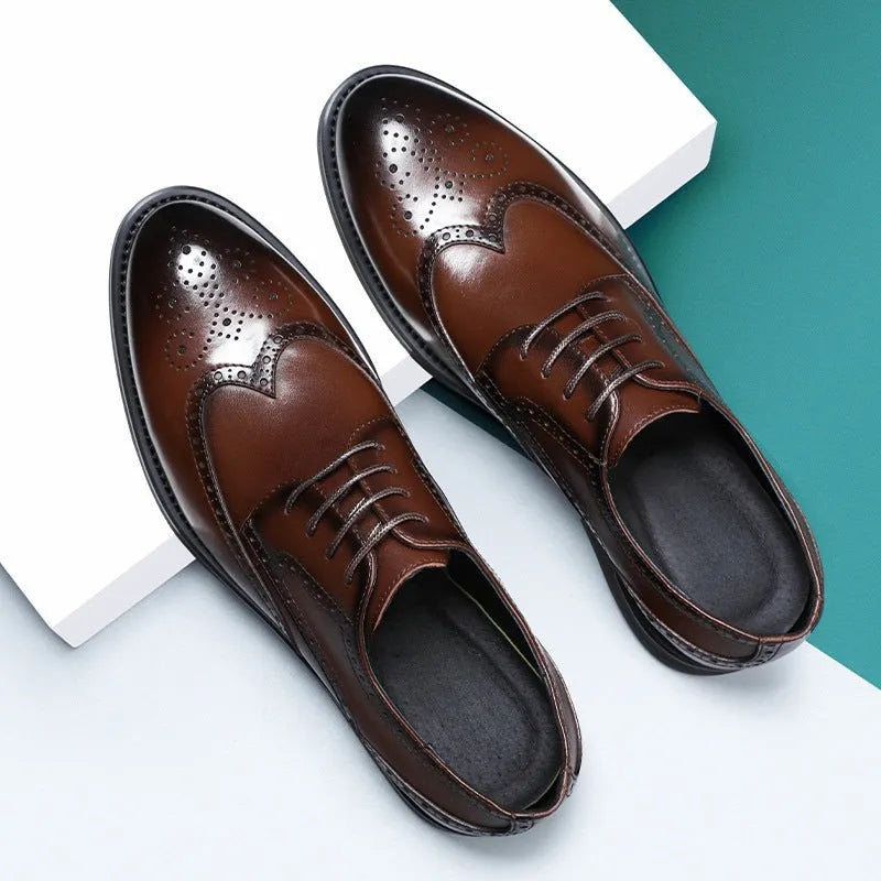 Men's black brogue leather shoes with traditional perforations and Oxford-style construction