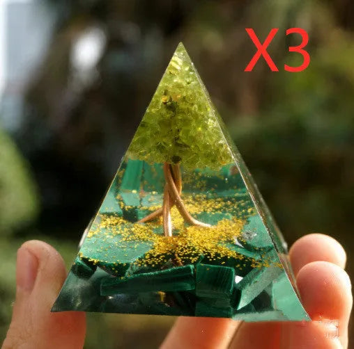 Clear epoxy resin pyramid ornament with embedded coloured crystal gravel inside, measuring 6cm.