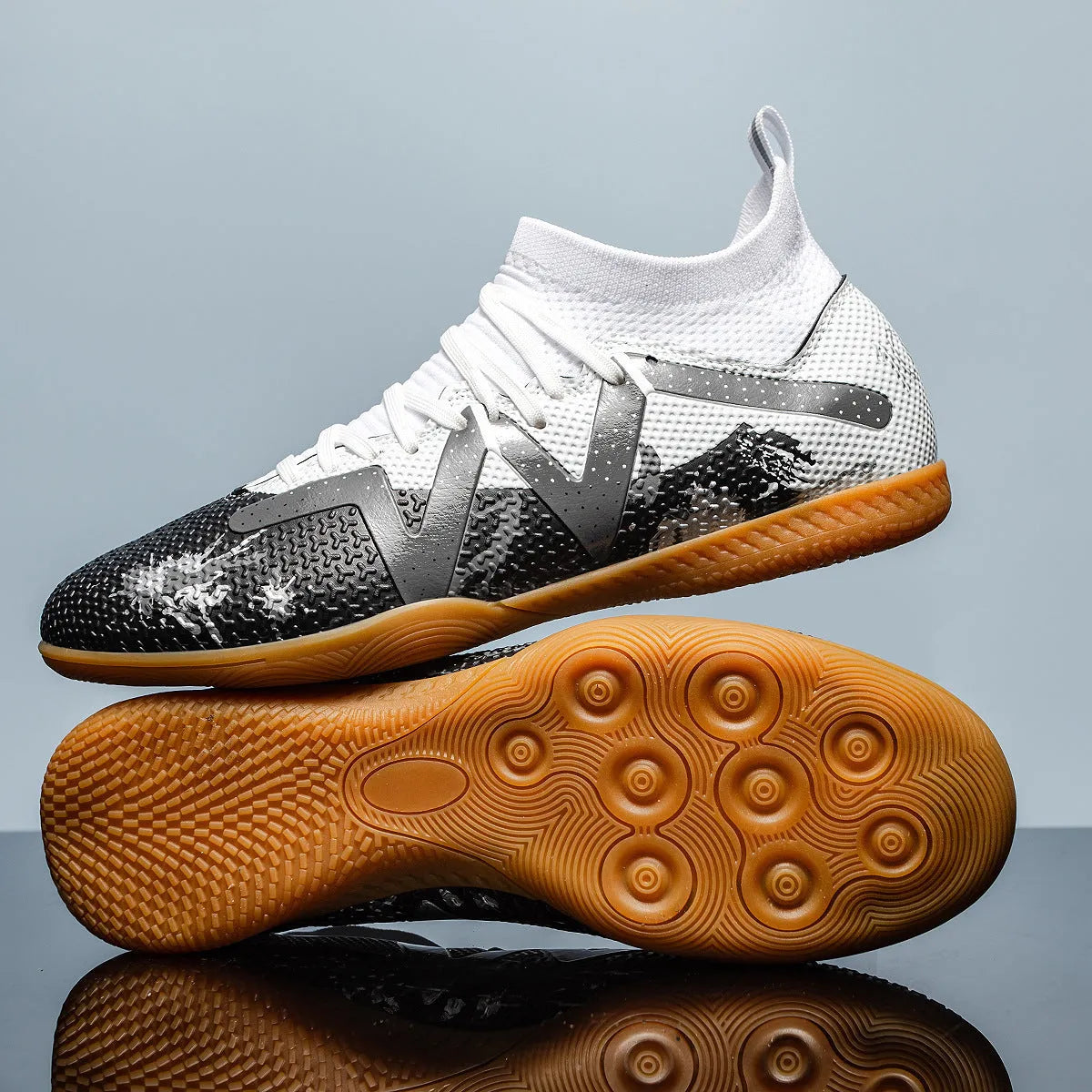 Adult low-top football boots with PVC upper and replaceable studs in black and yellow colourway