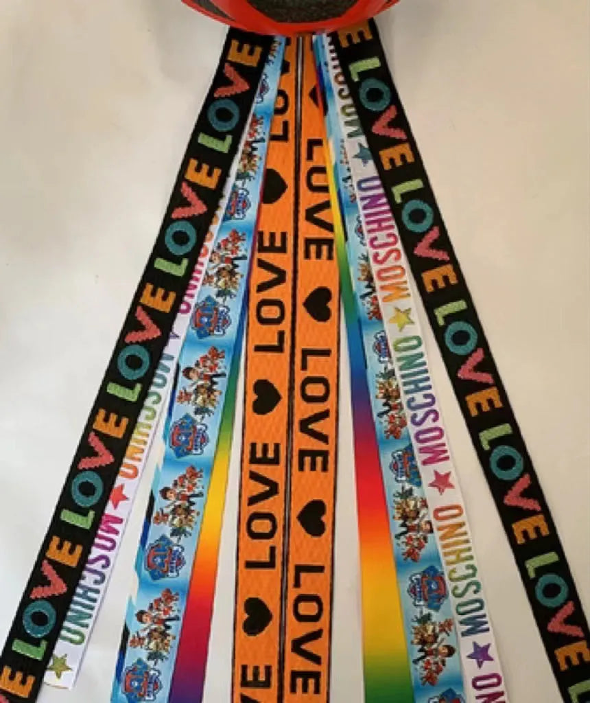A colourful helmet streamer accessory for children's sports helmets and doll decoration.