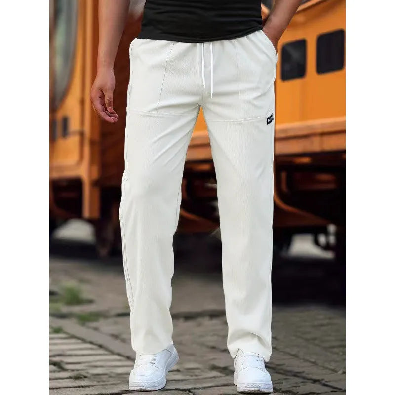 Men's casual polyester trousers for spring and autumn in light grey colour.