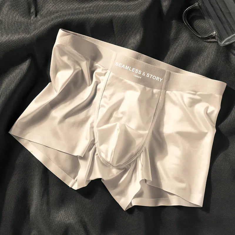 Men's solid colour ice silk nylon underwear in mid waist design on a neutral background.