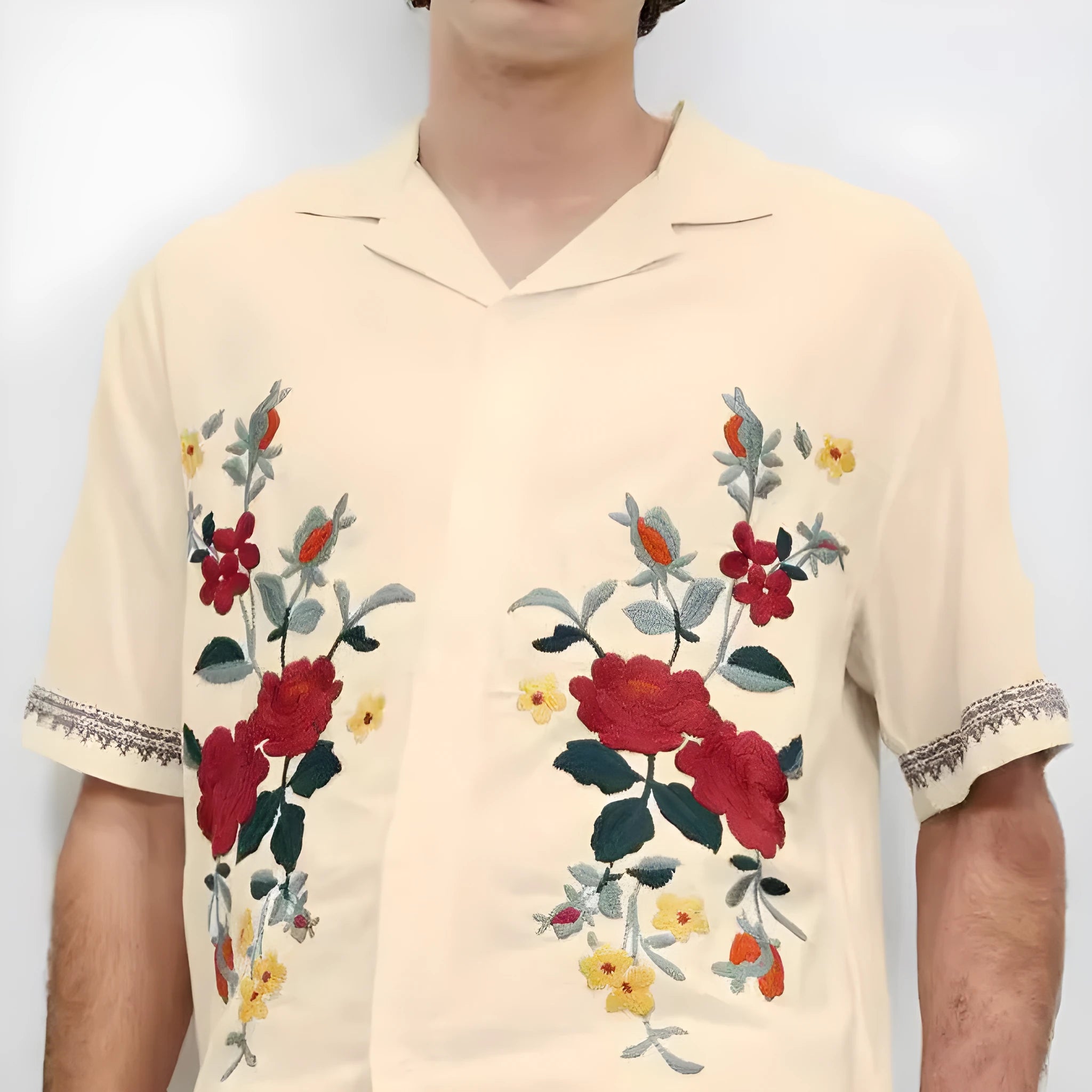 Men's apricot-coloured short-sleeve shirt with vintage floral print and lapel collar on a hanger.