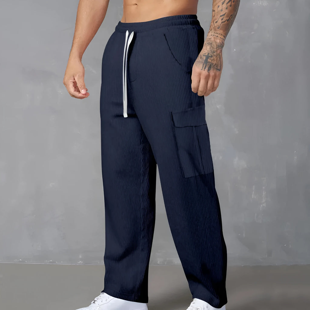 Men's loose-fitting corduroy cargo trousers in navy blue with straight wide-leg cut and elasticated waist