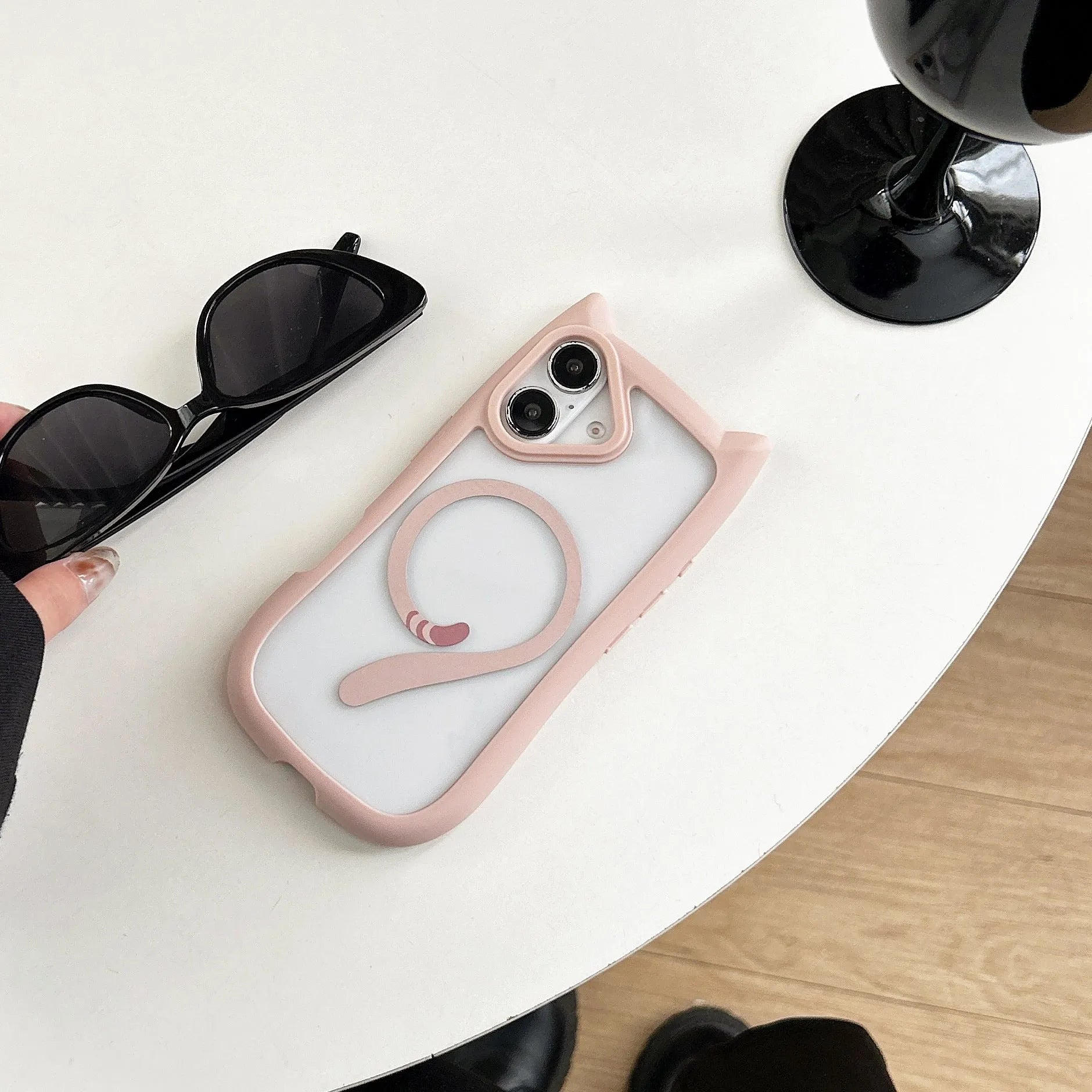 Transparent acrylic TPU iPhone 17 phone case showing magnetic suction feature and colour options