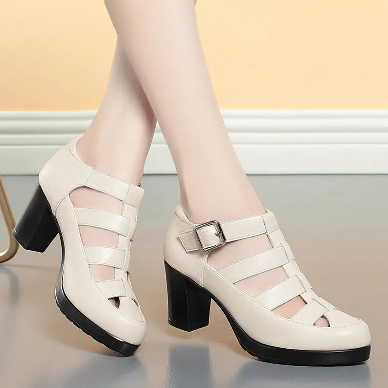 Women's beige closed toe sandals with chunky heel, woven pattern, buckle ankle strap, and back zipper.
