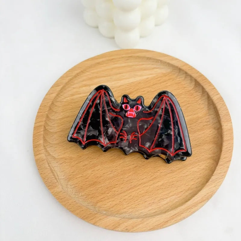 Halloween hair clip with shark and vinegar bat design in four style options