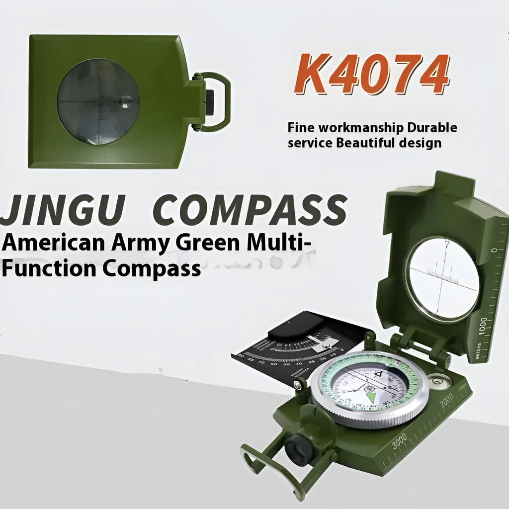 K4074 silver and black metal professional compass with hanging rope on a green background.