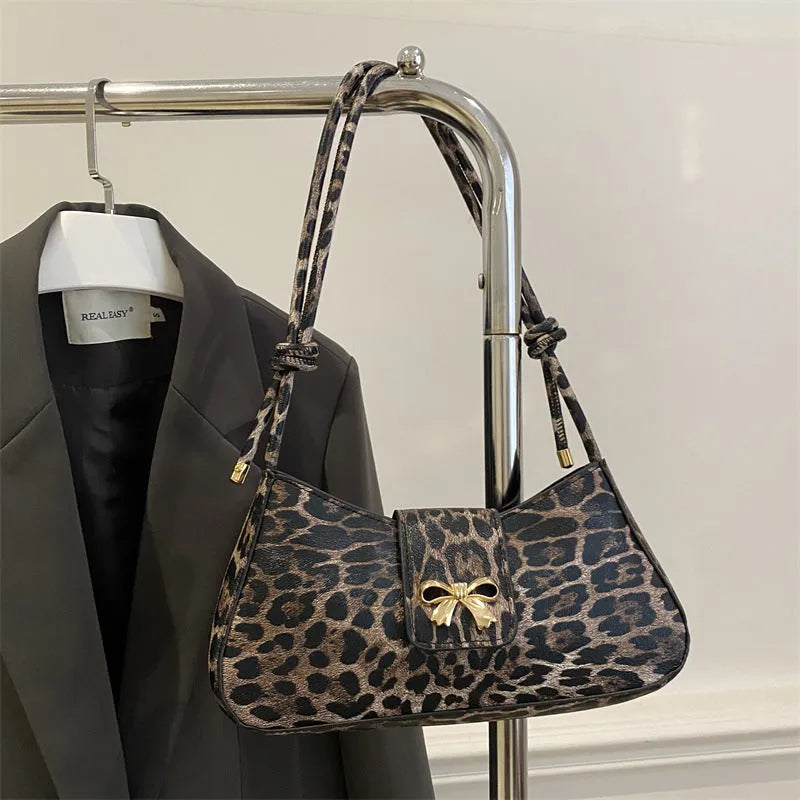 Women's large capacity casual PU handbag in black with sandwich pocket exterior design