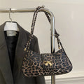 Women's large capacity casual PU handbag in black with sandwich pocket exterior design