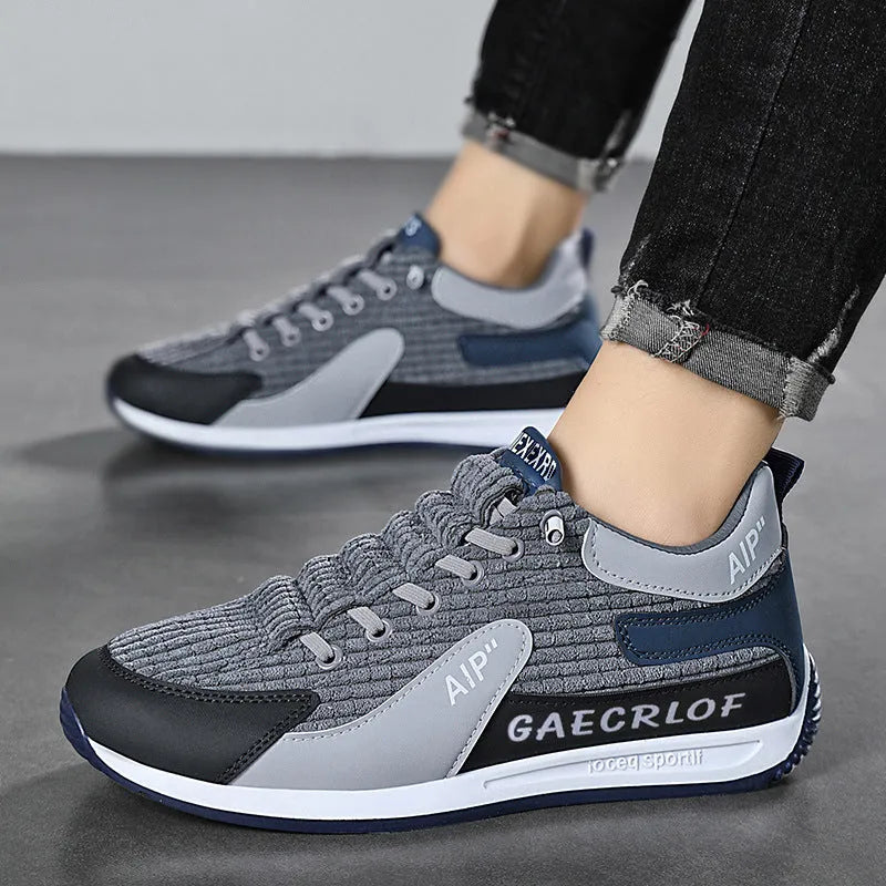Men's green and grey low-top mesh running shoes with round toe and lace-up front.