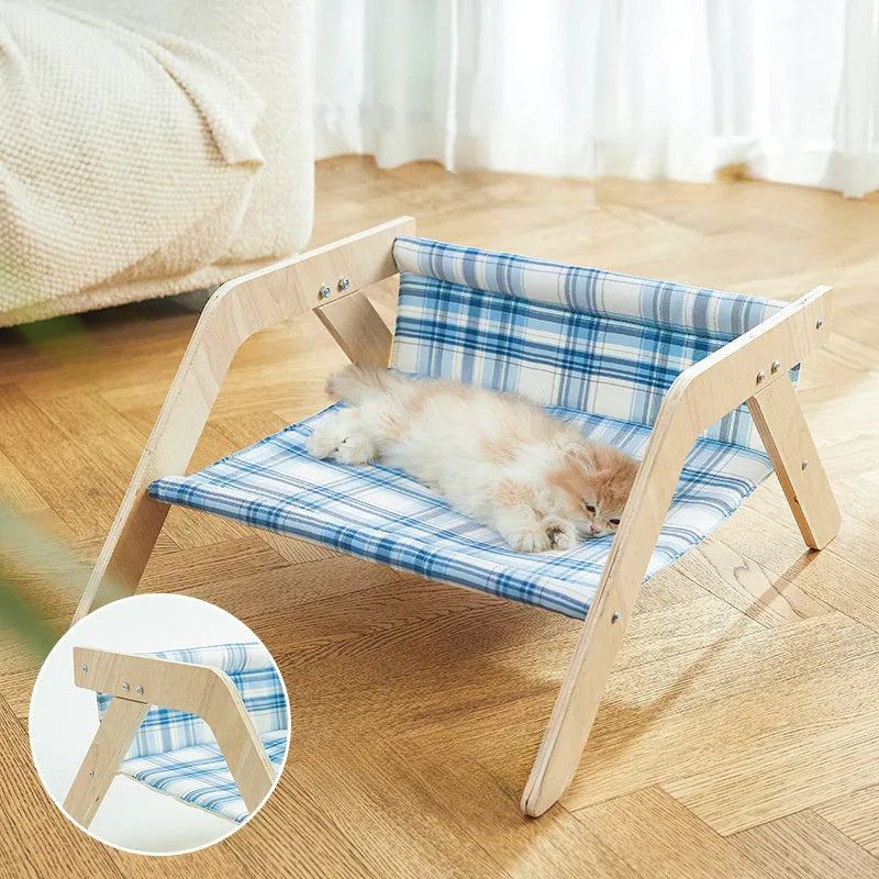 Blue wooden elevated cat bed with fabric hammock for indoor feline lounging