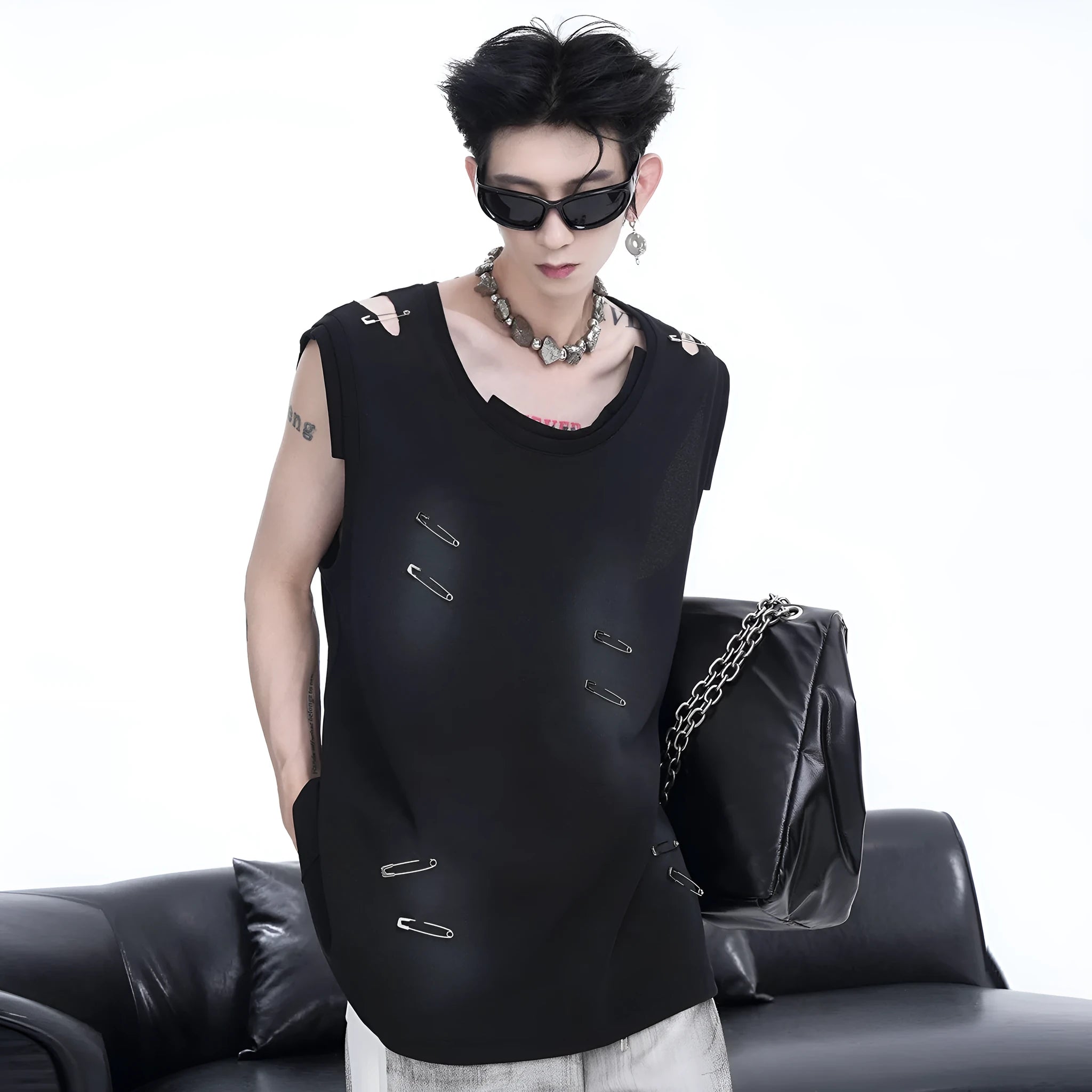 Men's black sleeveless vest t-shirt with irregular rip cut detail and round neck collar.