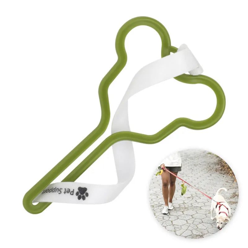Hands-free dog poop bag holder with black velcro strap and clip attached to a dog leash.