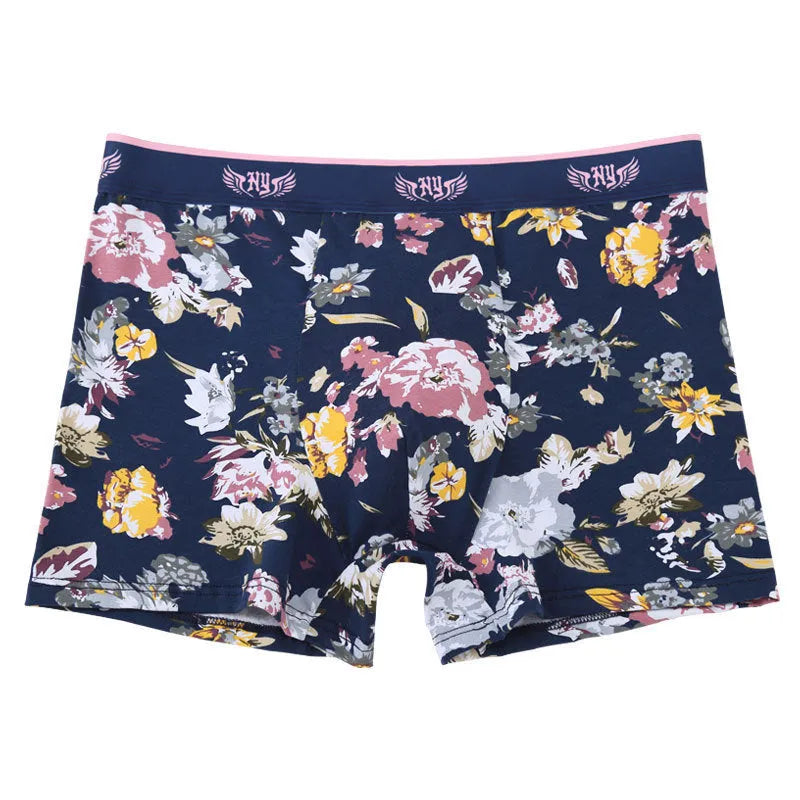 Men's cotton boxer shorts with floral print, showing mid-waist fit and U-shaped convex design.