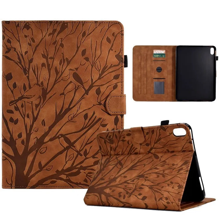 Black imitation leather tablet case with Pachira macrocarpa engraving and built-in viewing bracket open.