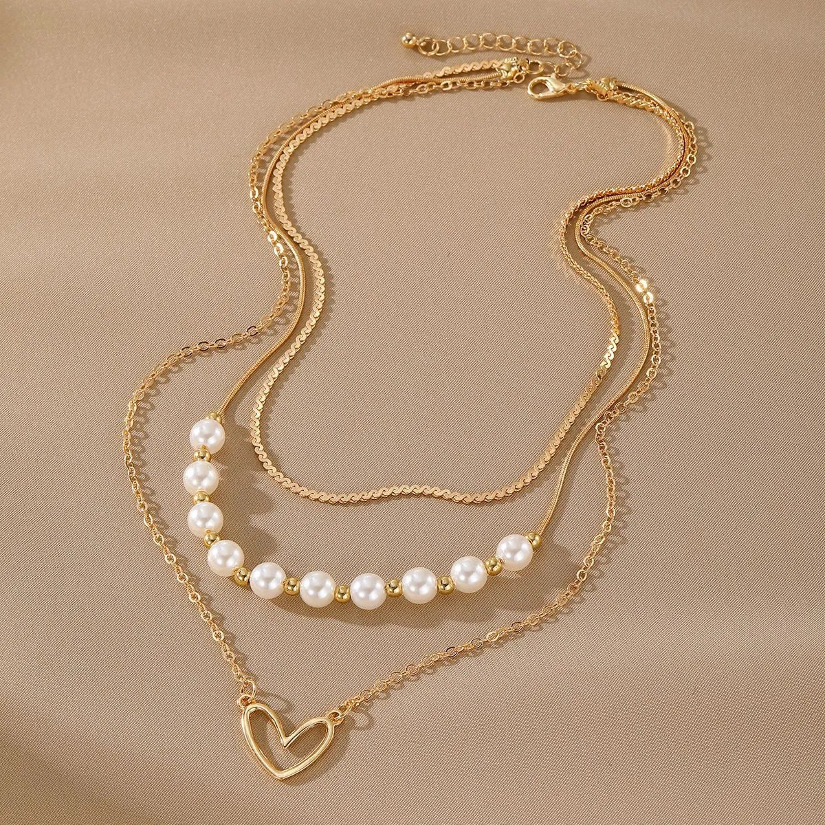 Vintage gold necklace with heart pendant on pearl-style chain, adjustable 41-50cm length