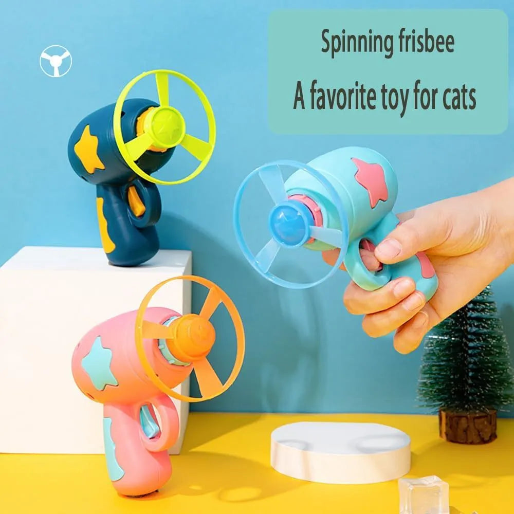 Blue plastic cat toy gun with rotating Frisbee launcher measuring 11cm tall for indoor cat play