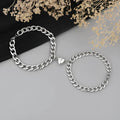 Silver magnetic couple bracelet with heart charm on stainless steel chain