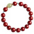 Cinnabar and coated metal geometric bracelet with elliptical beads in purple gold sand colour.