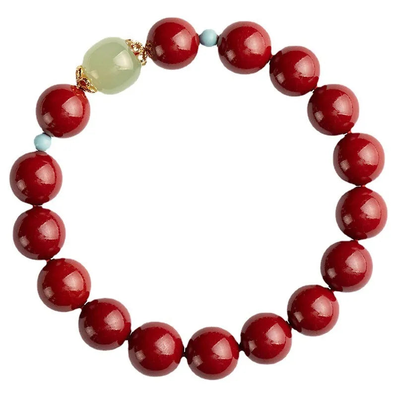 Cinnabar and coated metal geometric bracelet with elliptical beads in purple gold sand colour.