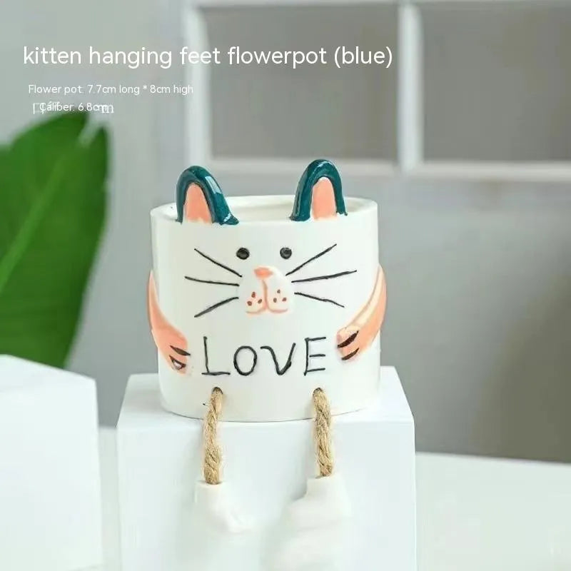Ceramic hanging foot flowerpot in a cartoon style for desktop succulents.