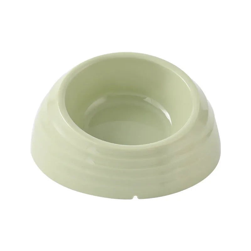 Stainless steel cat bowl on a plastic stand in light green, beige, or brown colour.
