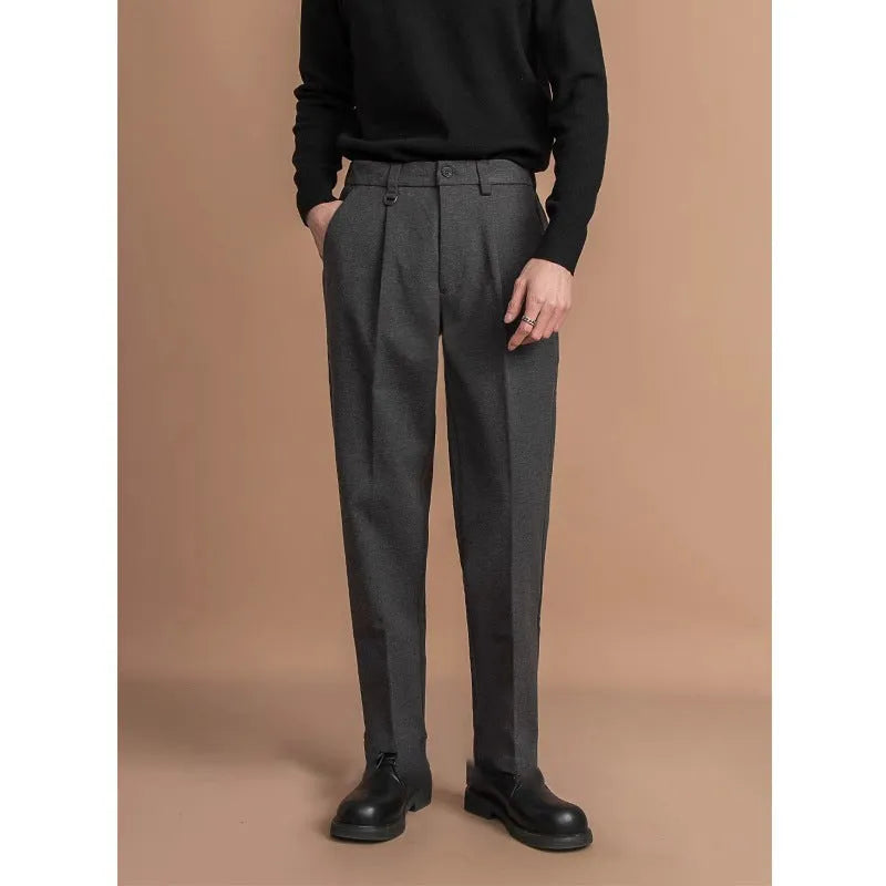 Man wearing straight-leg black polyester suit pants for business casual attire